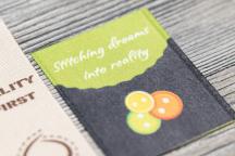 Satinera label with button motif and 'Stitching dreams into reality' text - Item no. 3002