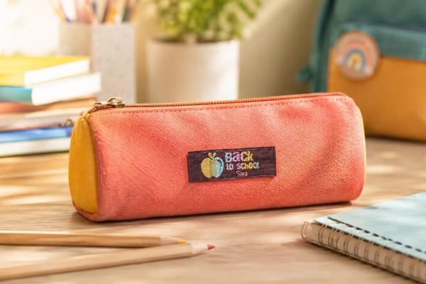 Bordeaux cotton label with rainbow lettering on pencil case