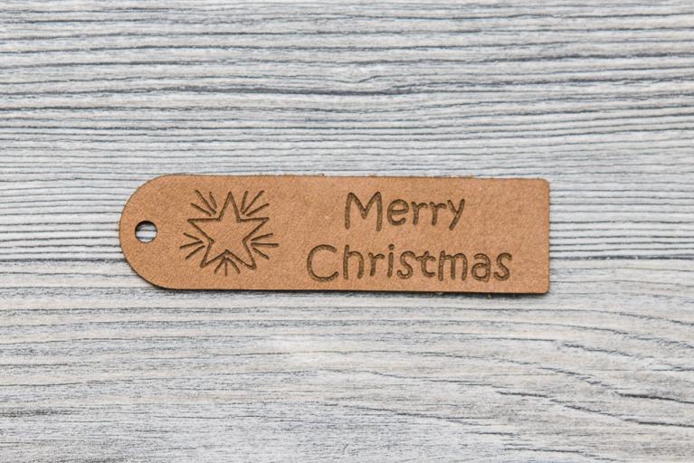 10 \"Merry Christmas\" natural leather hangtags  (Item number 8015)