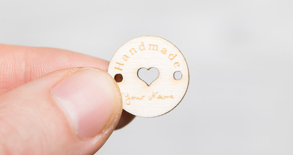Handmade label made of poplar wood to sew on