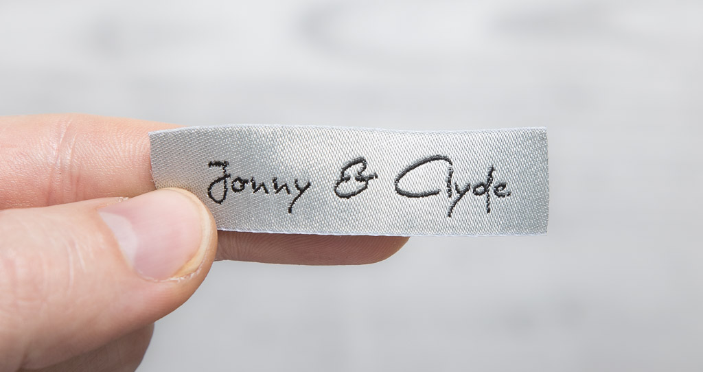 Woven label for sewing on